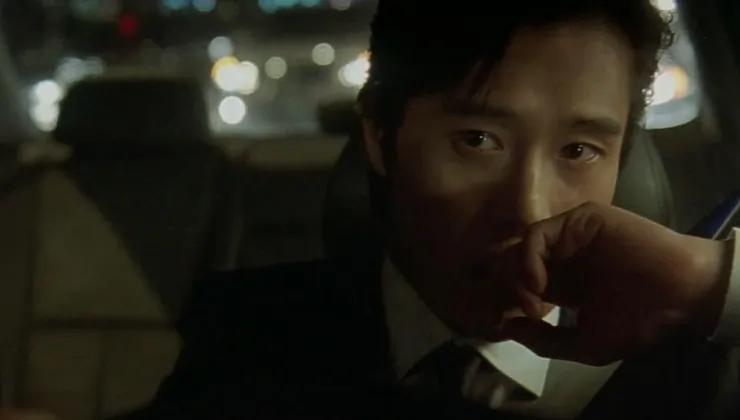 A Korean man looks on in A Bittersweet Life