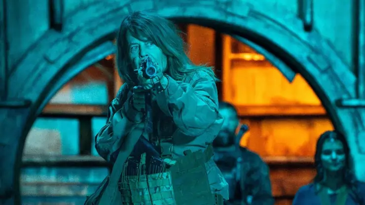 Linda Hamilton with a gun in Osiris