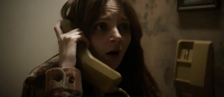 a woman calls for help in SHudder original Night of the reaper
