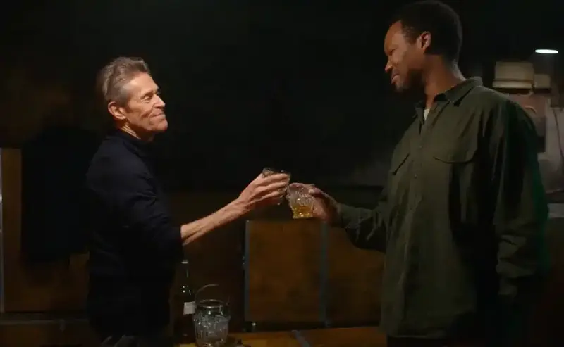 Two men toast in The Man In My Basement