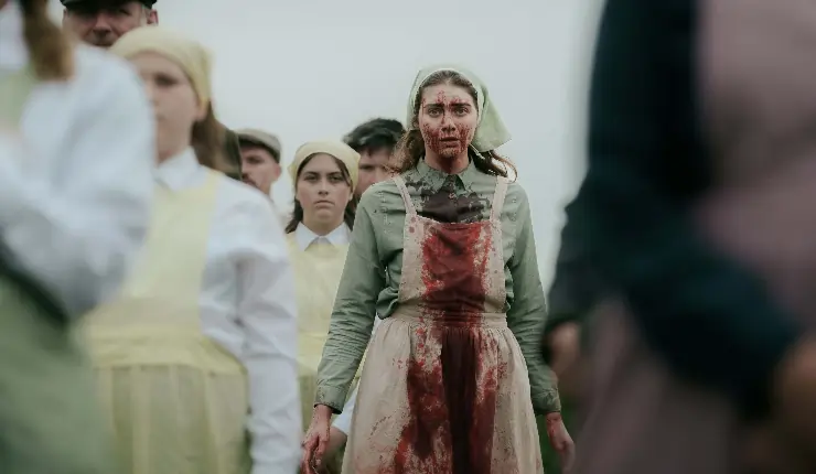 A young woman is covered in blood in The Severed Sun