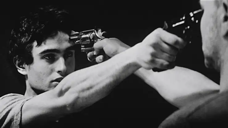 2 men points guns at each others forehead in 13 tzameti