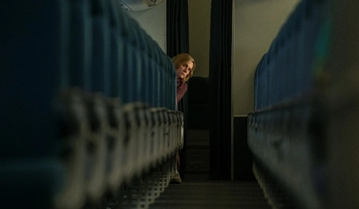 Rhea Seehorn is Carol looking down a train with