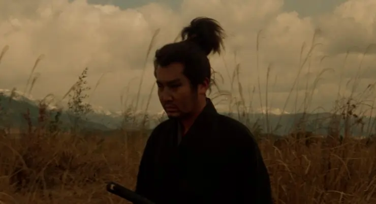 A lone Japanese Warrior walks in the countryside at sunset - Miyamoto Musashi