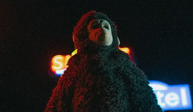 Someone dressed in a monkey fancy dress costume in Nina Conti's Sunlight.