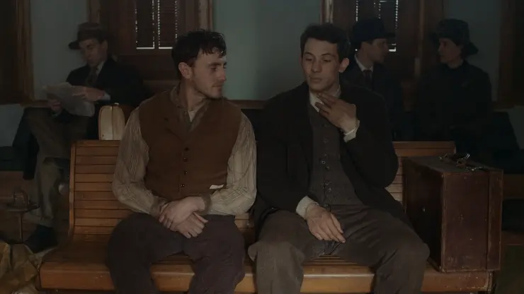 2 men sit together on a bench in The History Of Sound