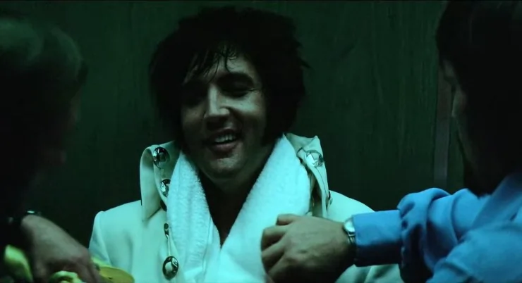 Elvis Presley smiling in a lift (credit Elvis Presley / Universal Pictures).