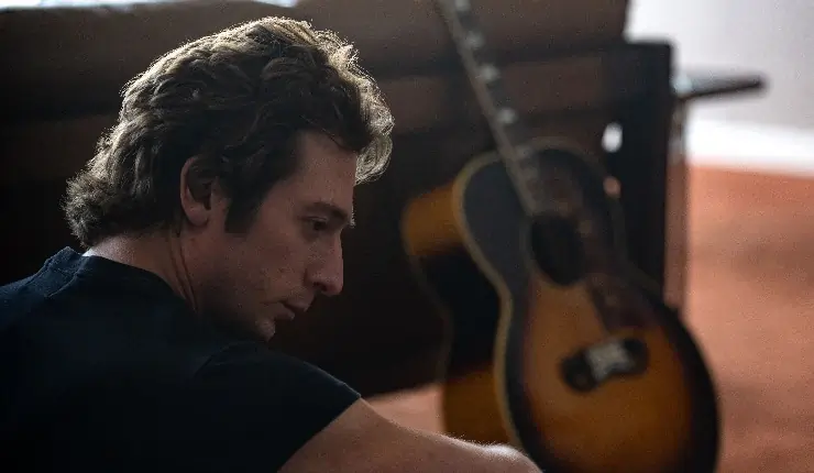 Jeremy Allen White as Bruce Springsteen in a deep thought of reflection.
