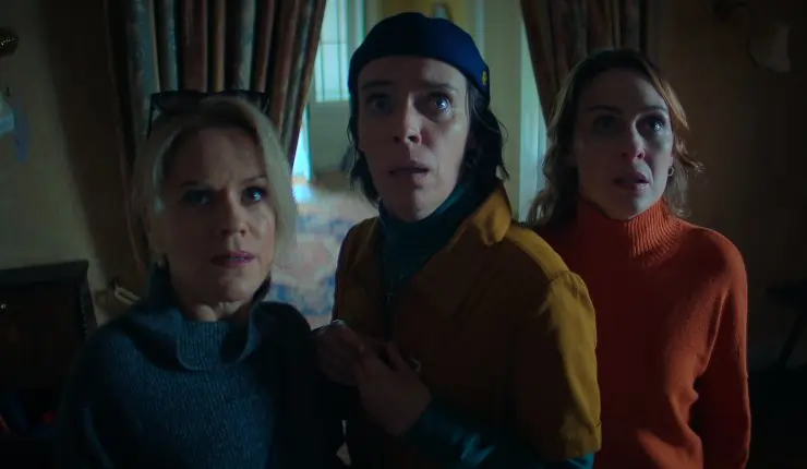 3 women sneak around the dark looking for something?