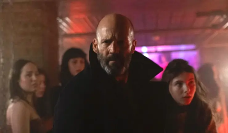 A middle aged man helps to rescue a young girl in Shelter.