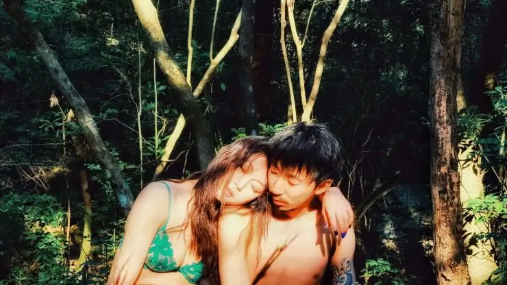 A young man and woman sit together in Cyclone