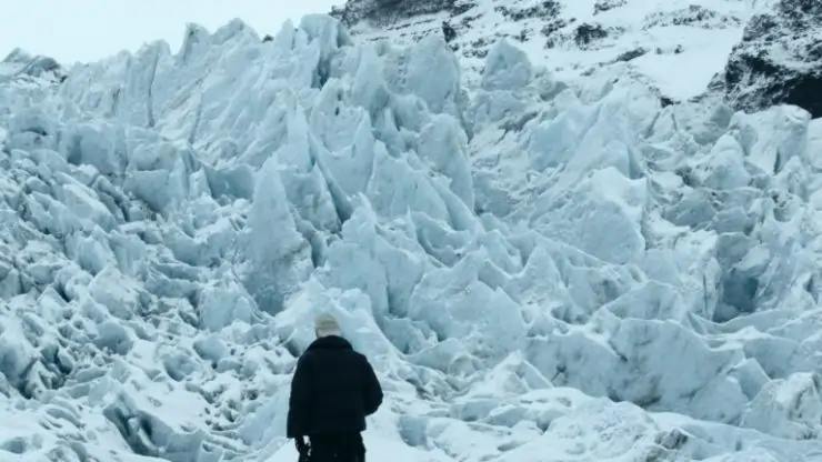 A man stands in front of a snowcap in La Pieta documentary