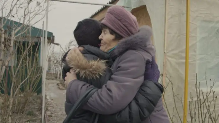 To women embrace each other with a hug in Traces documentary