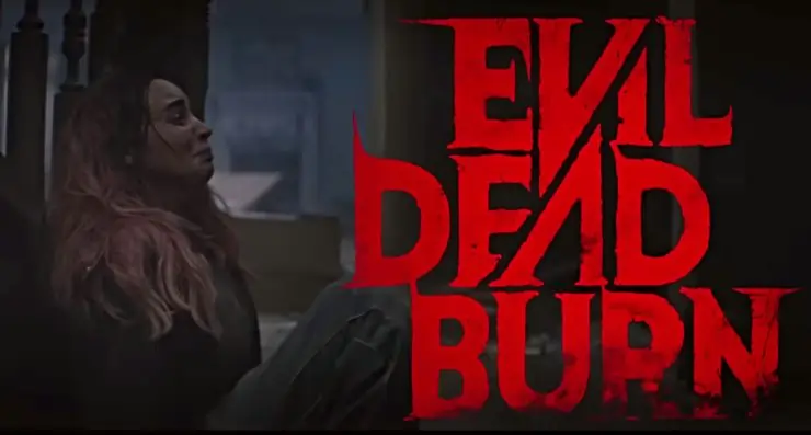 a pink haired woman hides in fear from Evil Dead Burn