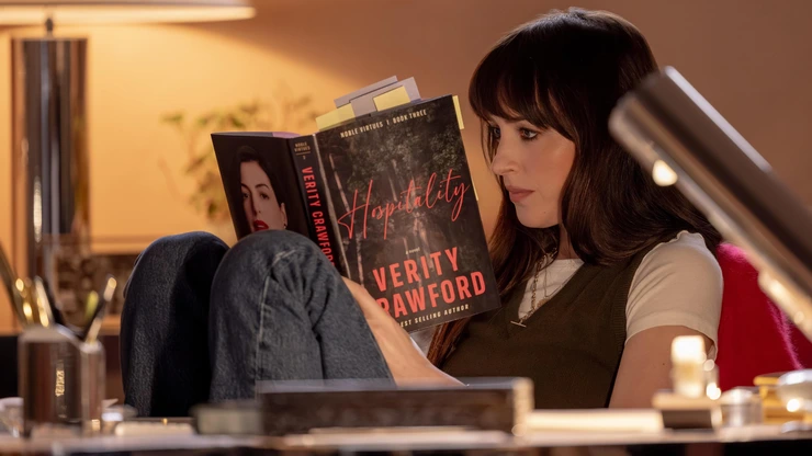 A woman reads a book in Verity trailer