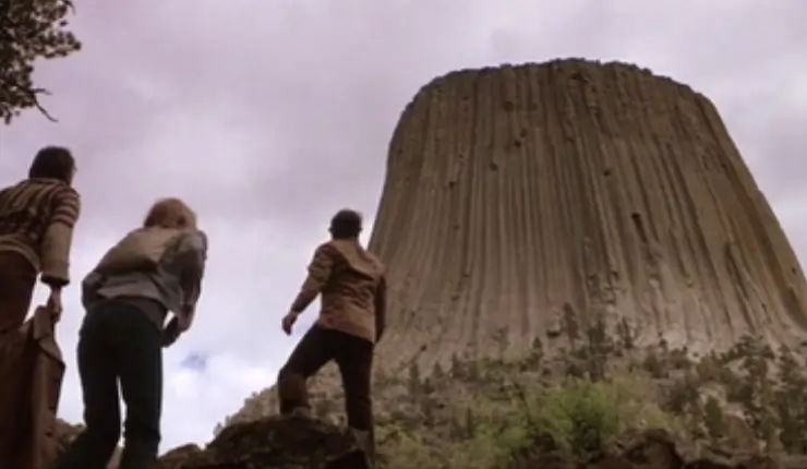 Characters looking at the mysterious mountain