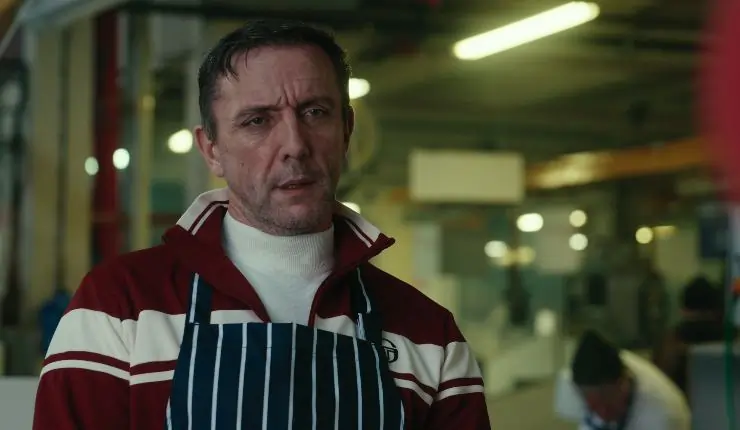 A man in a bib in The Gentlemen