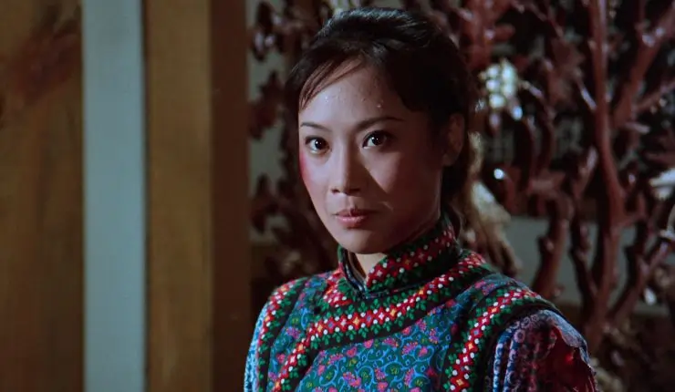 A woman in traditional dress ready to fight in The Himalayan (1976)