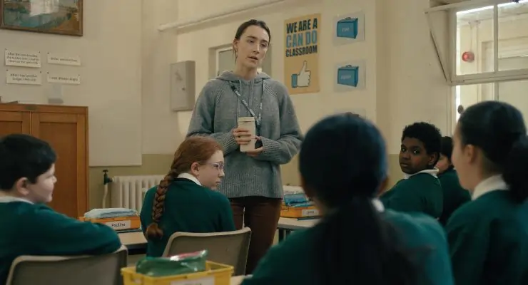 A young woman talks to her pupils in Bad Apples