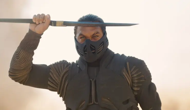 A masked warrior holds a dagger to his forehead in Dune: Part 3