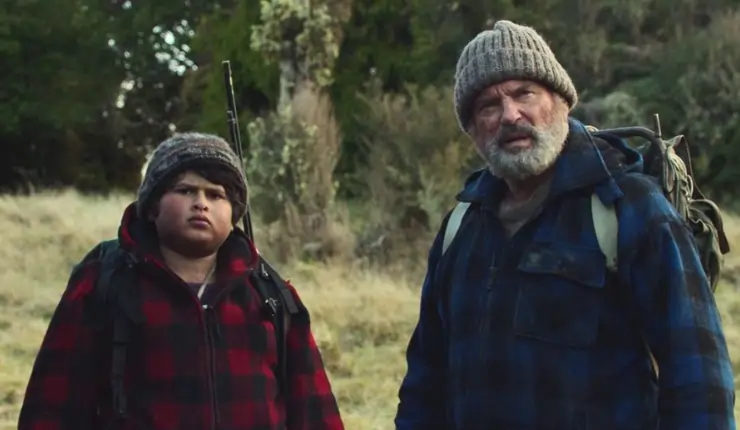 Sam Neill and Julian Dennison starring off into the distance.