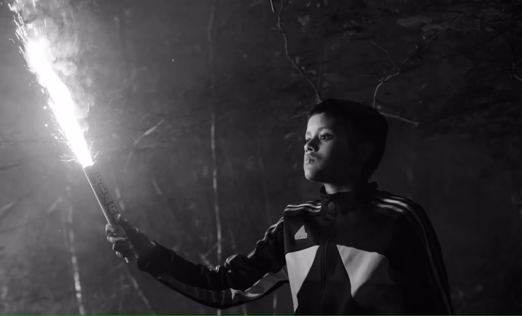 Image of boy holding firework in Ish movie