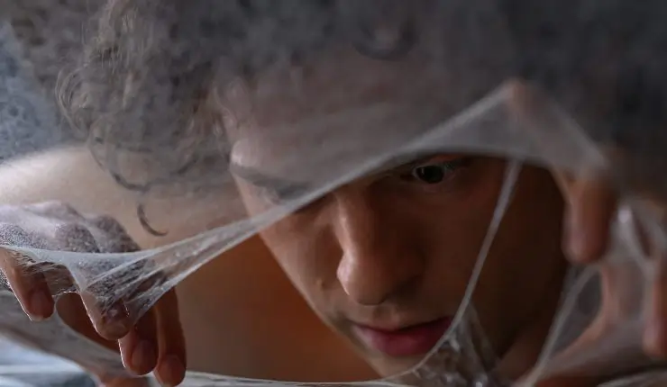 Peter Parker (Tom Holland) rips through web in Spider-Man: Brand New Day