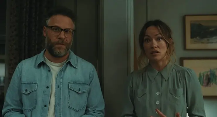 A man and woman possibly shocked at something in The Invite (directed by Olivia Wilde)