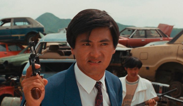 An angry man (Chow Yun Fat) with a gun searching for someone