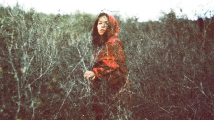 A woman in field