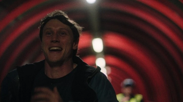 A young runs through a dimly lit place in Mission