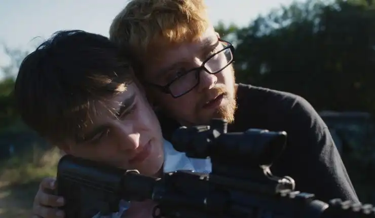 2 young men with a gun in Our Hero Balthazar