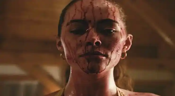A woman is covered in blood