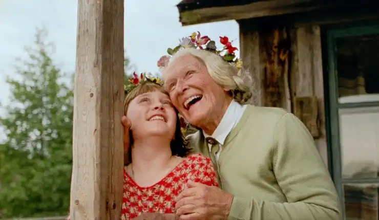 An older woman enjoy a laugh with her granddaughter in The Summer Book
