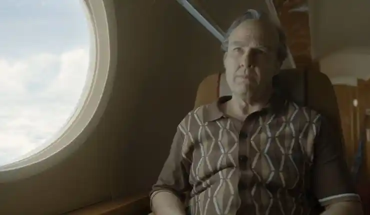 Tom Cruise looks ready sitting on a plane in Digger