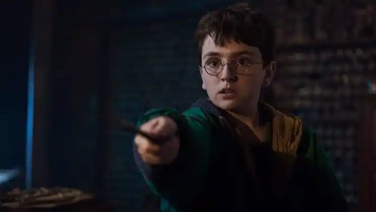 Younf Harry points his wand at someone in new HBO Max Harry Potter series