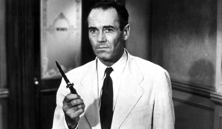 Henry Fonda holding a switch knife
