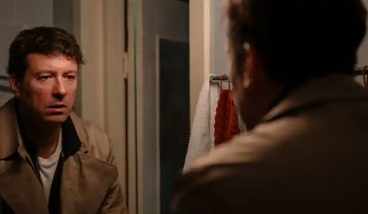 A man looks at himself in the mirror in Minotaur