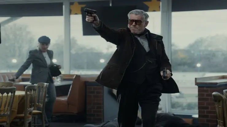 A man holding two guns