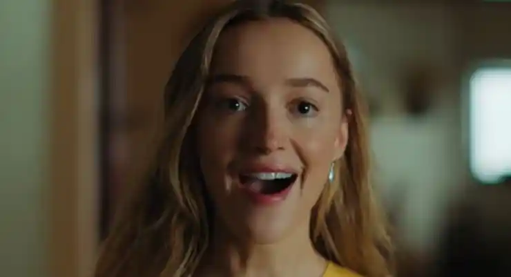 A young woman smiles in Remain watch trailer