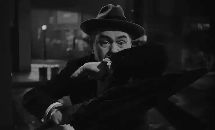Edward G. Robinson covers his face in classic Film Noir Scarlet Street