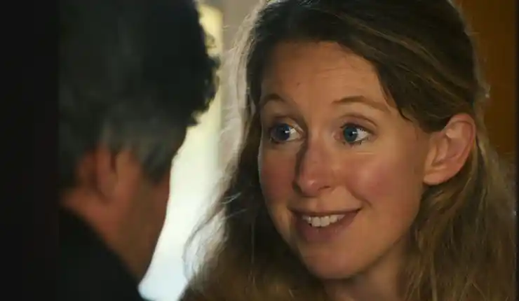 A woman talking to a man in You Can See Everything