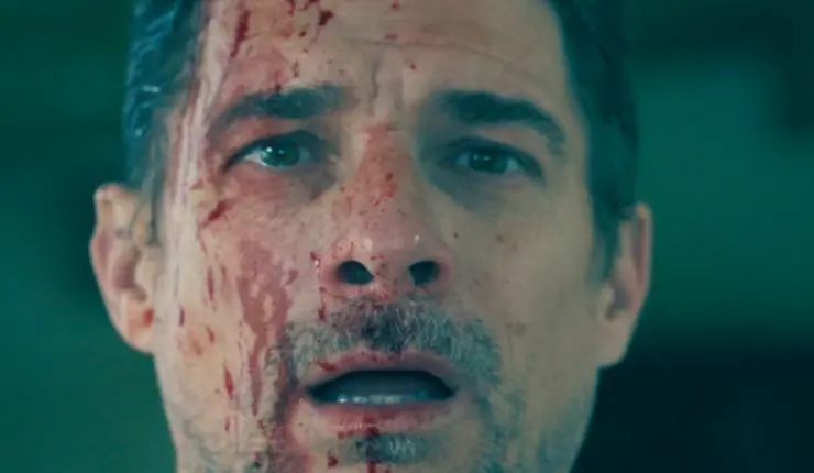 A man with a bloodied face