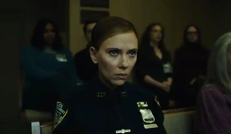 a young cop looks on in The Exorcist: Martyrs